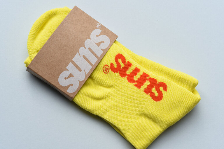sums running club sock packaging